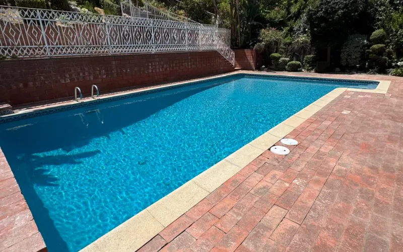 pool replaster before and after, swimming pool renovation, modern backyard pool, pool resurfacing project, outdoor living space, California pool remodeling