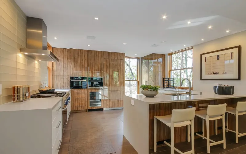 kitchen renovation, kitchen design, workflow, kitchen triangle, efficient layout, galley kitchen, L-shaped kitchen, U-shaped kitchen, countertops, cabinets, quartz countertops, solid wood cabinetry, flooring options, porcelain tiles, engineered hardwood, lighting, task lighting, ambient lighting, under-cabinet lighting, custom cabinetry, smart storage solutions, pull-out shelves, corner cabinets, drawer dividers, backsplash designs, color schemes, smart appliances, home automation, kitchen technology, personalizing your space, Caspi Construction